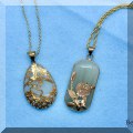 J17. Gold and stone pendants. 